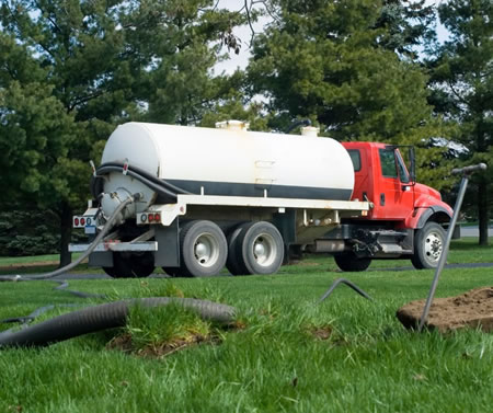 Septic pumping truck near a keystone heights home